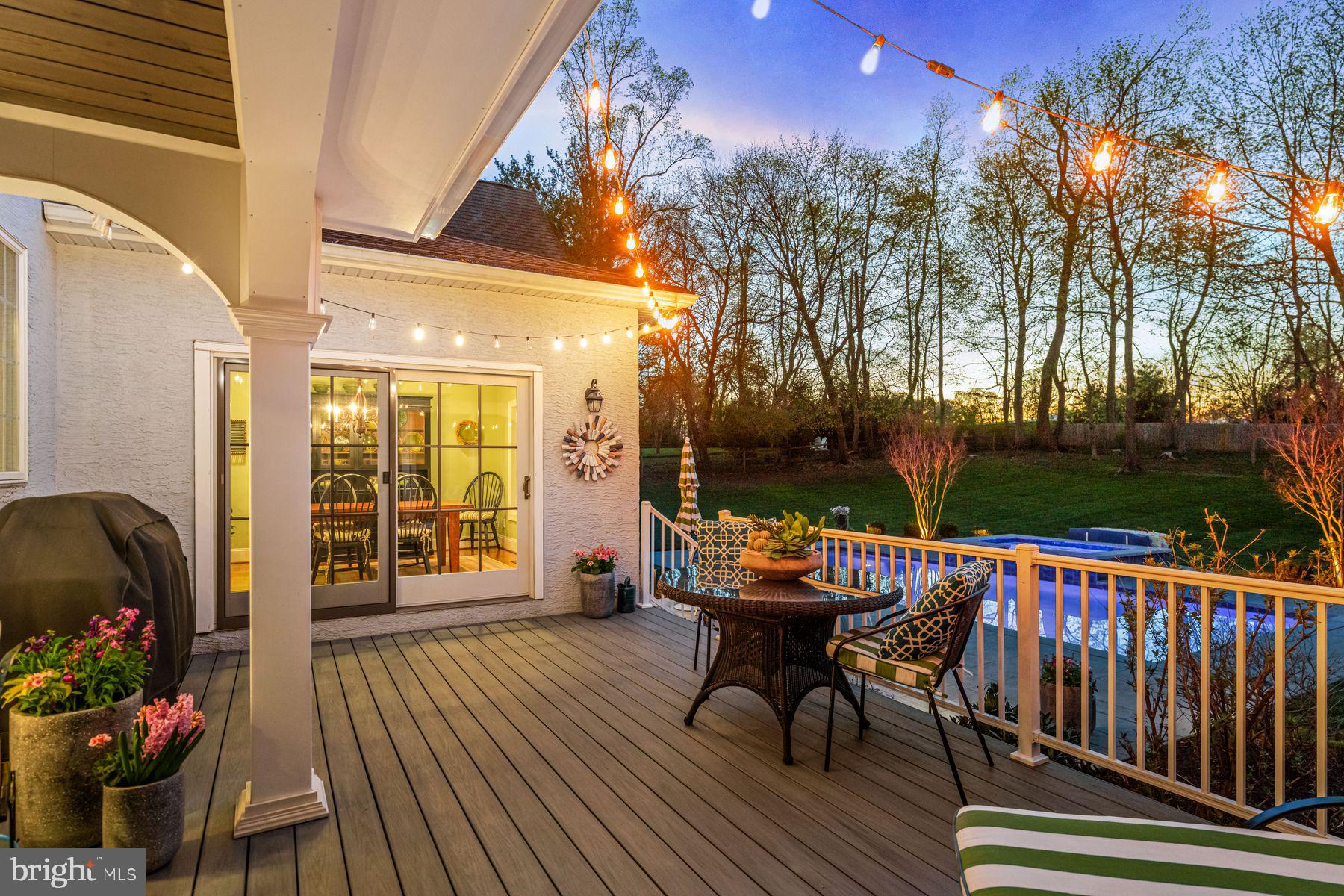 321 Exeter Road Devon, PA 19333 - Photo 7 of 79 a balcony with wooden floor table and chairs