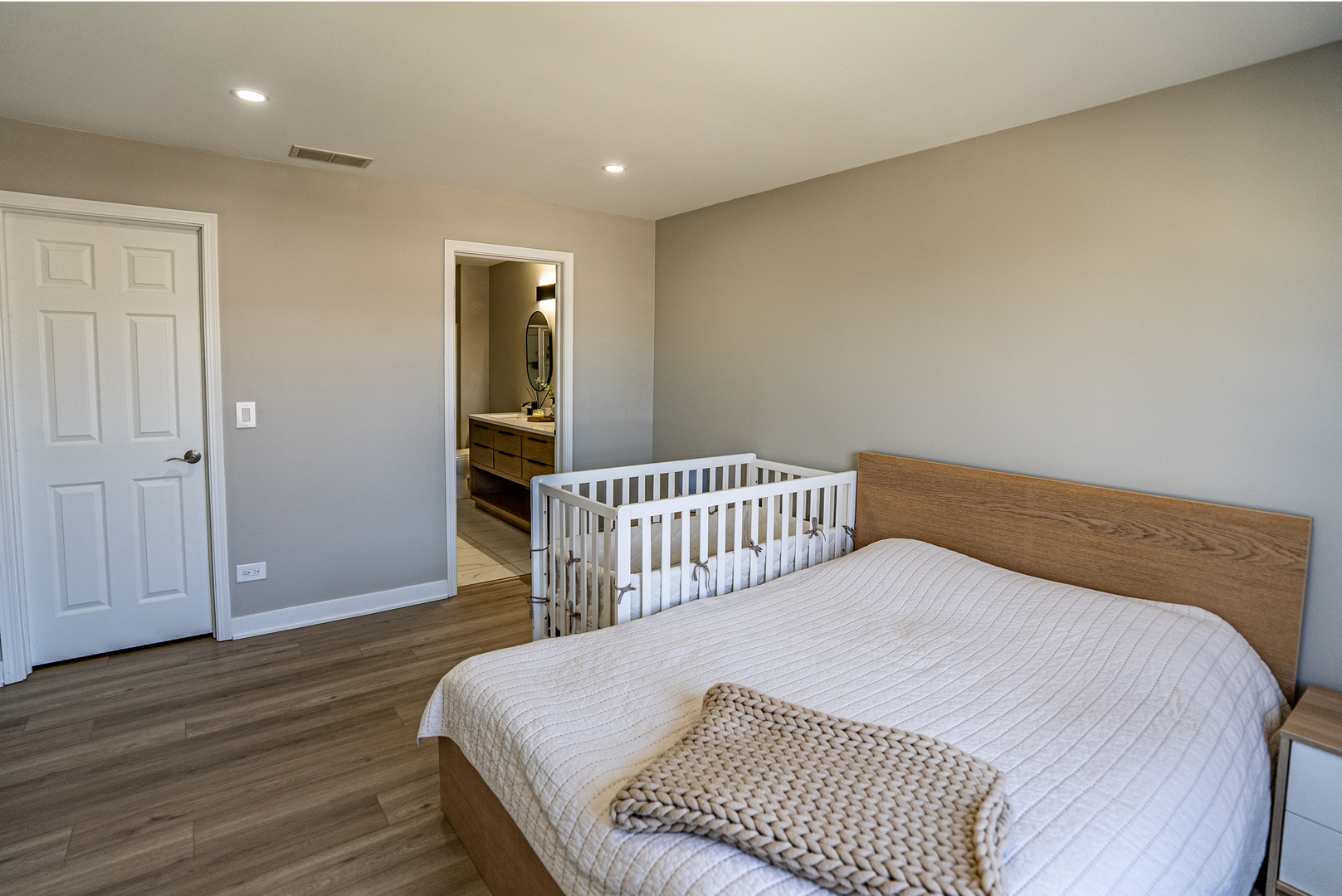 383 Woodview Circle, Unit C Elgin, IL 60120 - Photo 11 of 20 a bedroom with a bed and wooden floor