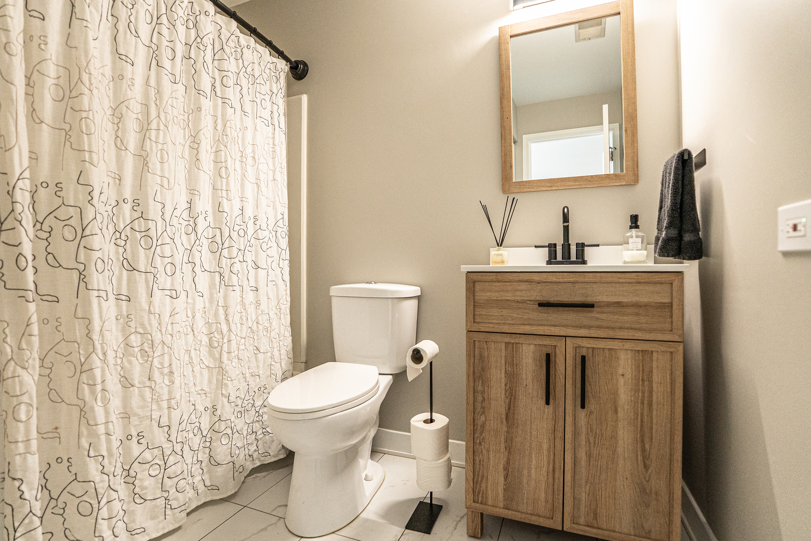 383 Woodview Circle, Unit C Elgin, IL 60120 - Photo 16 of 20 a bathroom with a sink a toilet and a mirror