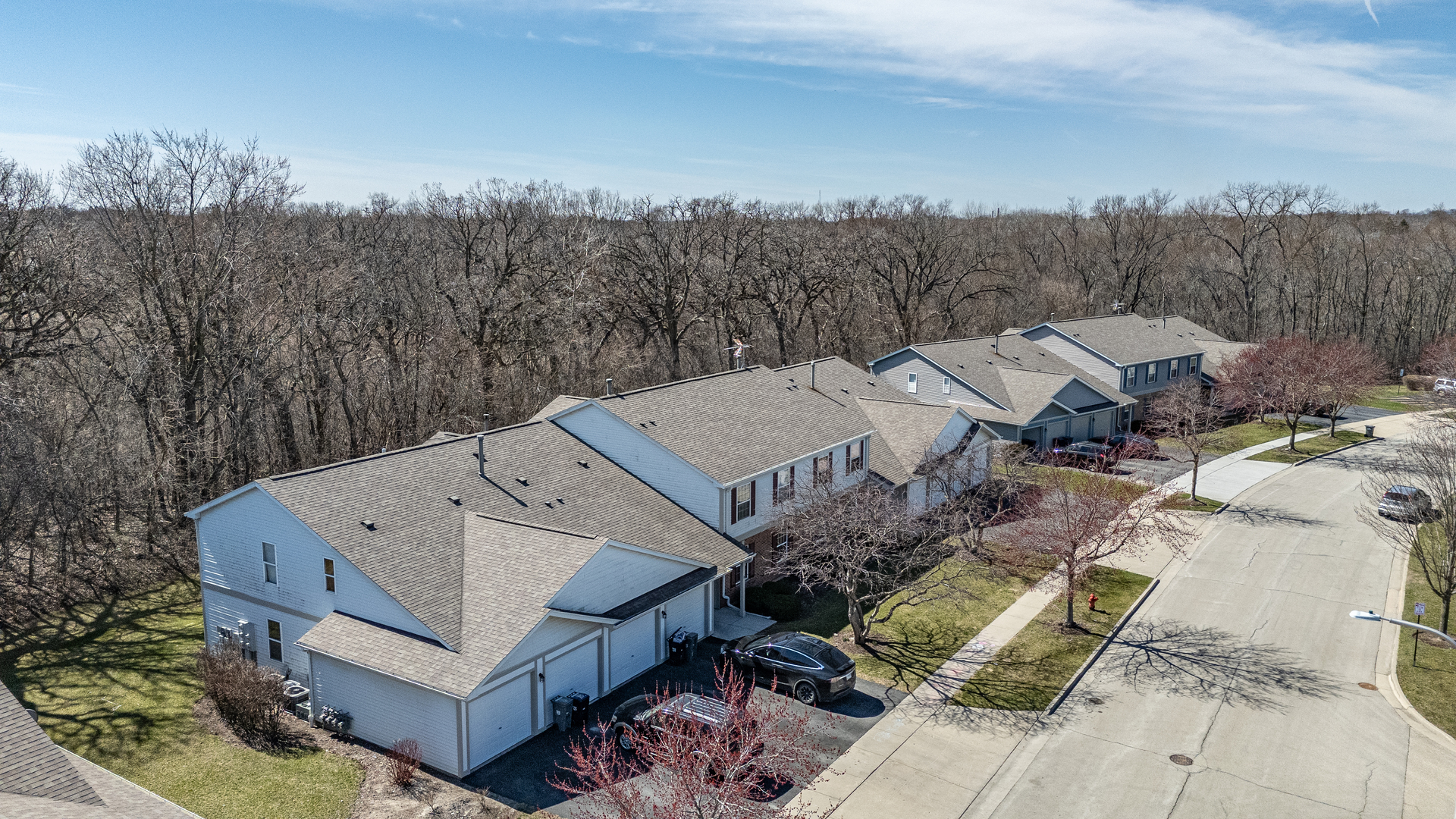 383 Woodview Circle, Unit C Elgin, IL 60120 - Photo 2 of 20 an aerial view of a house with a yard and mountain view in back
