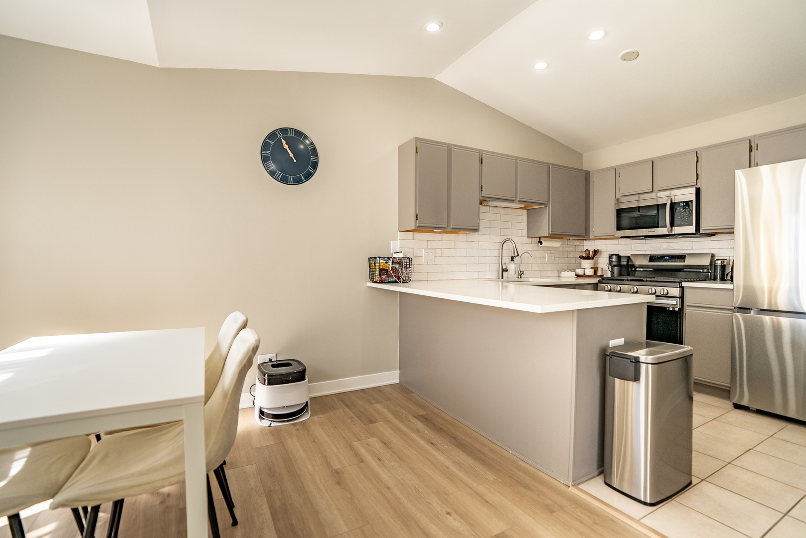 383 Woodview Circle, Unit C Elgin, IL 60120 - Photo 7 of 20 a kitchen with kitchen island a sink appliances and cabinets