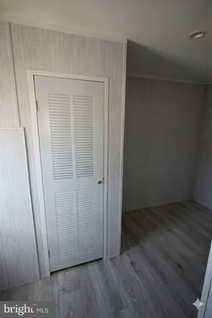 an empty room with wooden floor
