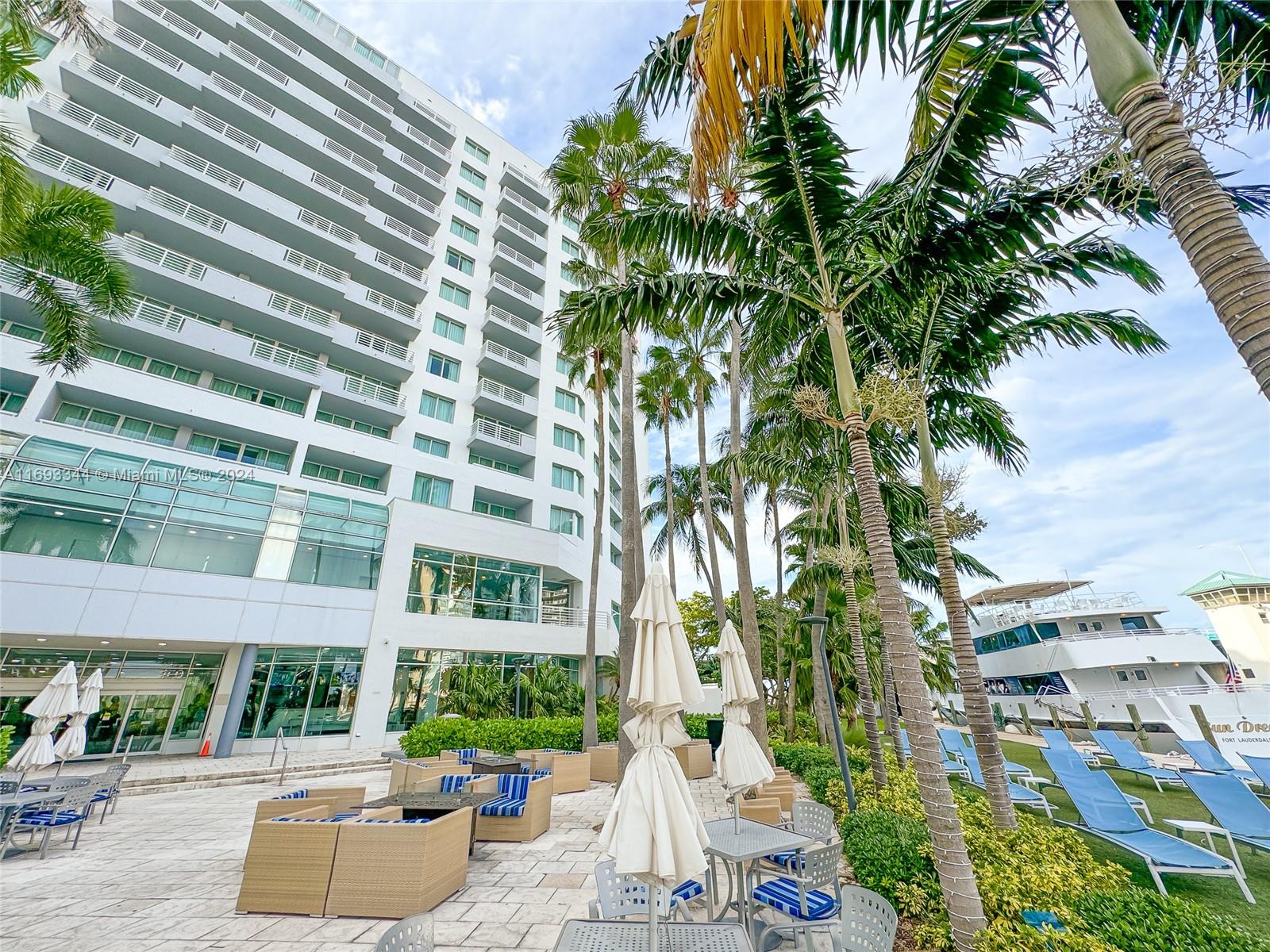 2670 East Sunrise Boulevard, Unit 528 Fort Lauderdale, FL 33304 - Photo 19 of 37 a view of a tall building with a garden and plants