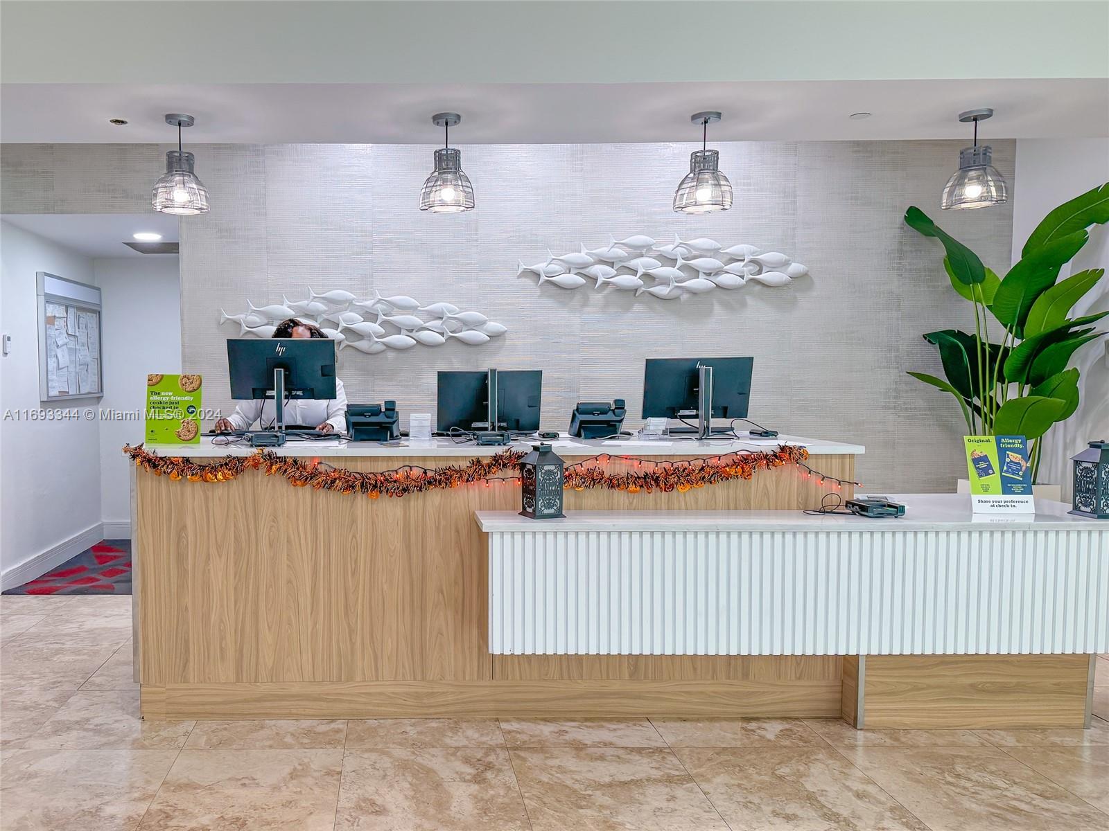 2670 East Sunrise Boulevard, Unit 528 Fort Lauderdale, FL 33304 - Photo 20 of 37 a living room with furniture and a chandelier