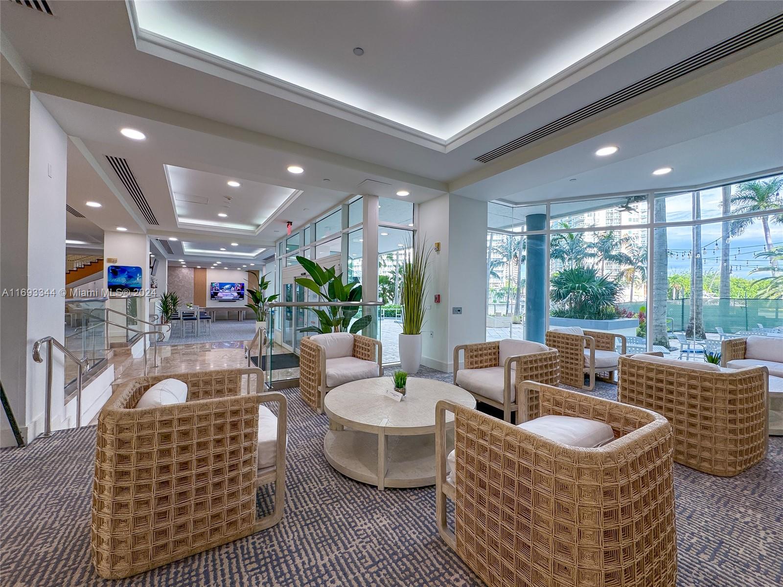 2670 East Sunrise Boulevard, Unit 528 Fort Lauderdale, FL 33304 - Photo 21 of 37 a living room with furniture and a large window