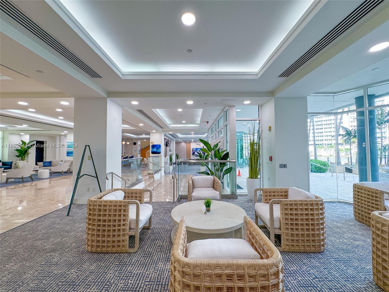 2670 East Sunrise Boulevard, Unit 528 Fort Lauderdale, FL 33304 - Photo 24 of 37 a living room with furniture and a large window
