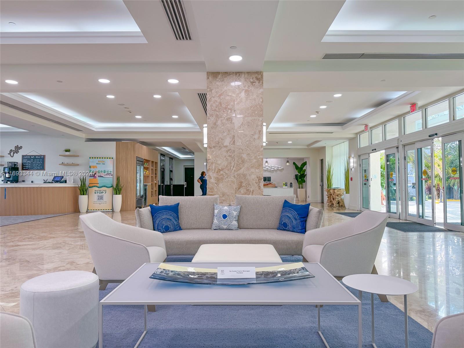 2670 East Sunrise Boulevard, Unit 528 Fort Lauderdale, FL 33304 - Photo 31 of 37 a living room with furniture and a large window