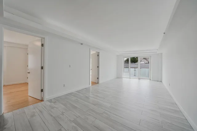 a kitchen with stainless steel appliances granite countertop a stove and a refrigerator