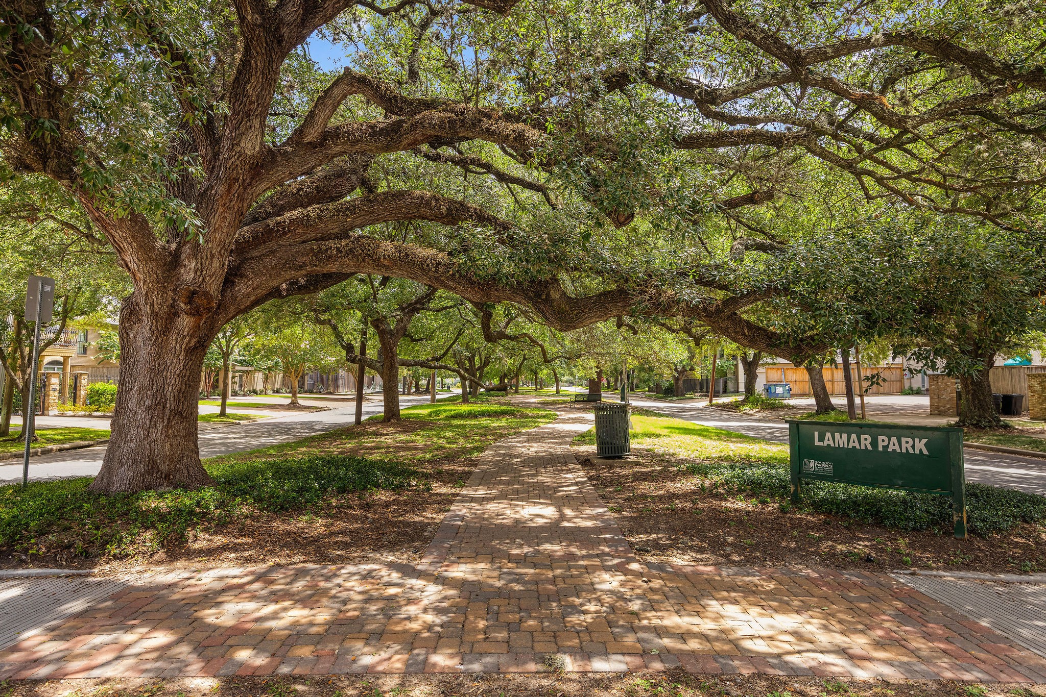 2415 Commonwealth Street Houston, TX 77006 - Photo 26 of 26 The tree-lined Lamar Park esplanade is just steps away, offering a picturesque setting for walking, jogging, or enjoying the beauty of one of Montrose's most charming streets.