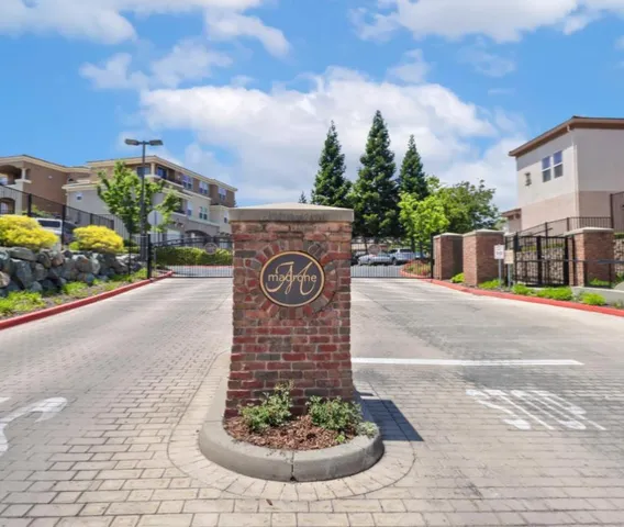 a view of a street with a building in the background