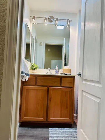 a bathroom with a sink and a mirror