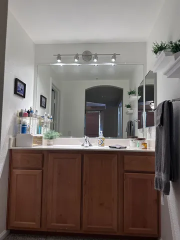 a kitchen with a sink and refrigerator