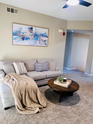 a living room with furniture and a couch