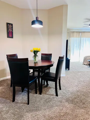 a view of a dining room with furniture