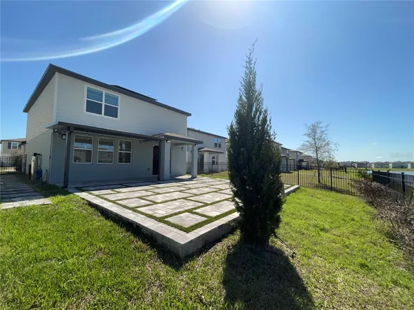 a house view with a backyard