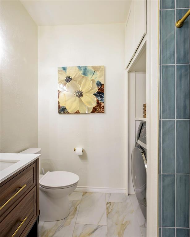 3605 Brown Street, Unit 106 Dallas, TX 75219 - Photo 14 of 19 a bathroom with a toilet and a shower