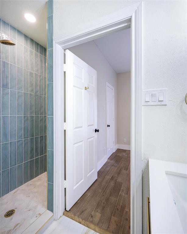 3605 Brown Street, Unit 106 Dallas, TX 75219 - Photo 16 of 19 a view of a bathroom with shower