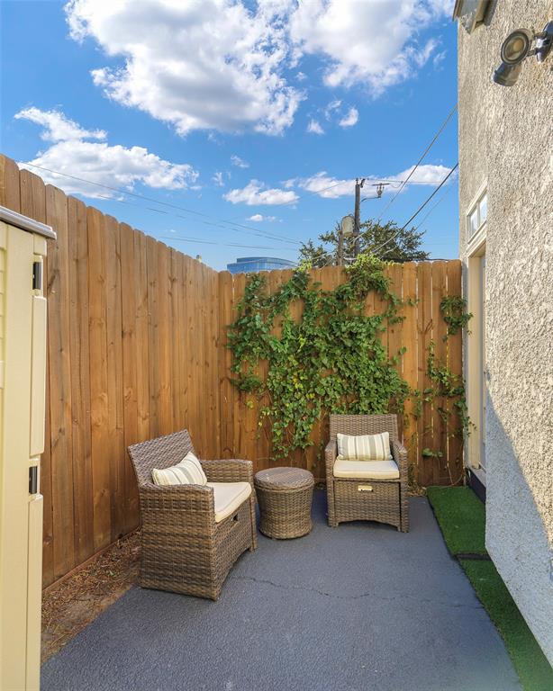 3605 Brown Street, Unit 106 Dallas, TX 75219 - Photo 17 of 19 a view of a patio with couches and a fire pit and furniture