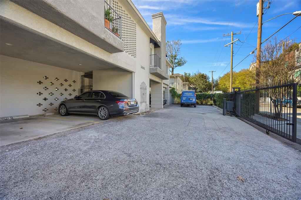 3605 Brown Street, Unit 106 Dallas, TX 75219 - Photo 18 of 19 a view of car parked in front of house