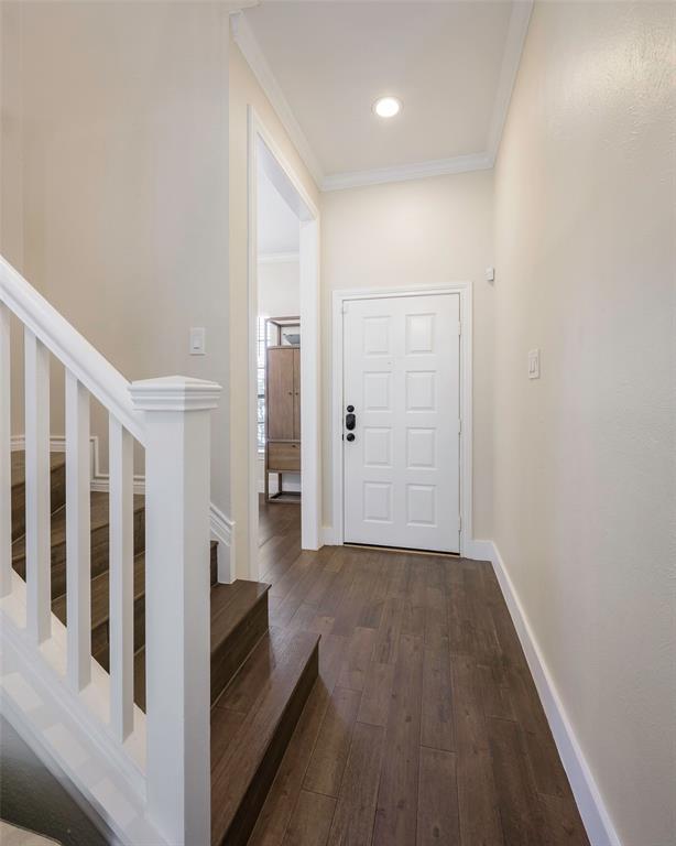 3605 Brown Street, Unit 106 Dallas, TX 75219 - Photo 5 of 19 wooden floor in a hall with an entryway