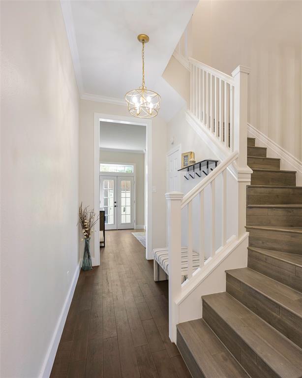 3605 Brown Street, Unit 106 Dallas, TX 75219 - Photo 6 of 19 a view of entryway and hall with wooden floor