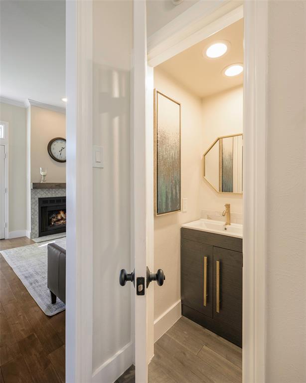 3605 Brown Street, Unit 106 Dallas, TX 75219 - Photo 7 of 19 a bathroom with a sink and a mirror