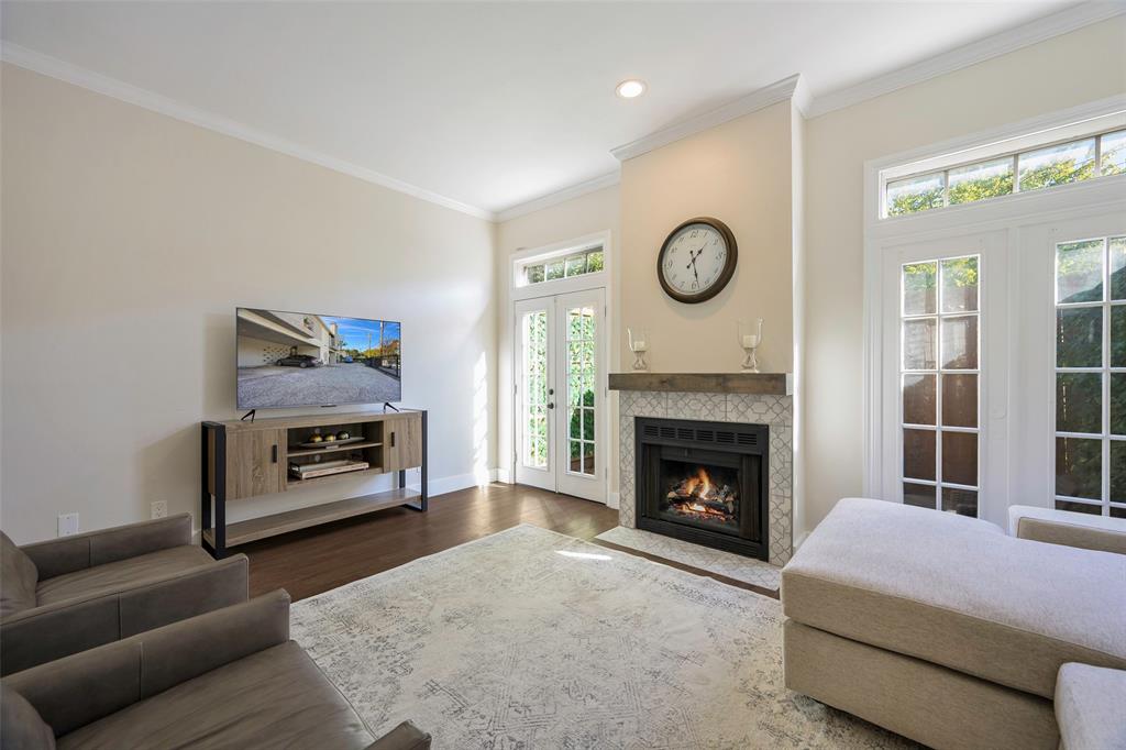 3605 Brown Street, Unit 106 Dallas, TX 75219 - Photo 8 of 19 a living room with furniture and a fireplace