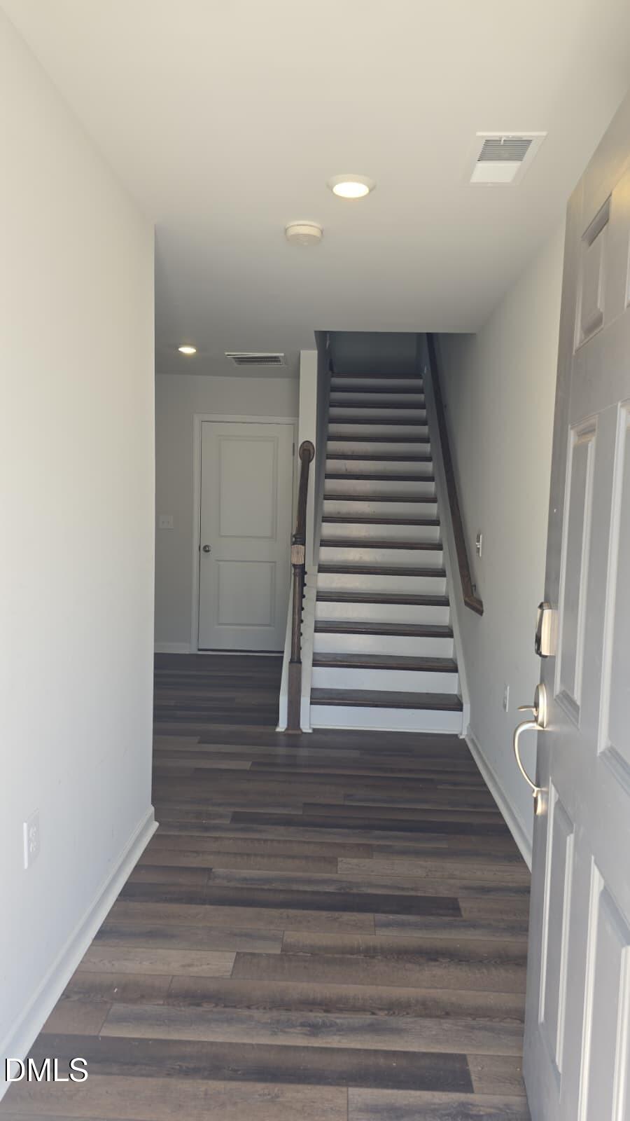 2610 Chert Lane Raleigh, NC 27610 - Photo 3 of 32 a view of entryway and hall with wooden floor