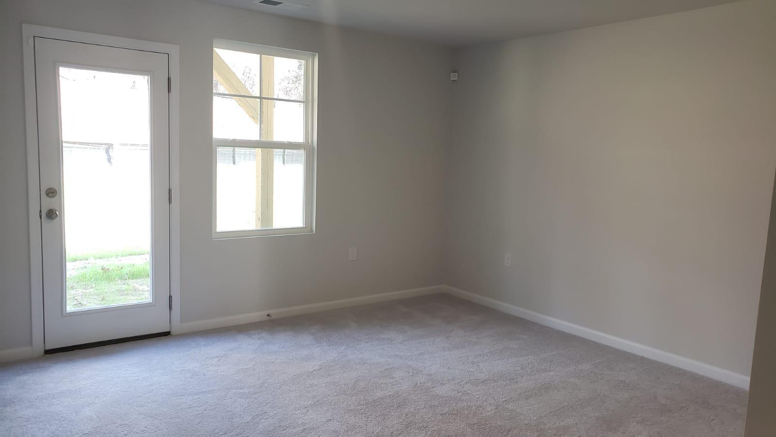 2610 Chert Lane Raleigh, NC 27610 - Photo 4 of 32 an empty room with a window