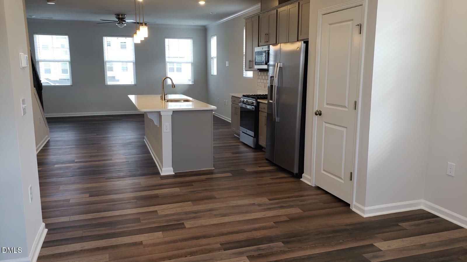 2610 Chert Lane Raleigh, NC 27610 - Photo 10 of 32 a view of a hallway with wooden floor and staircase