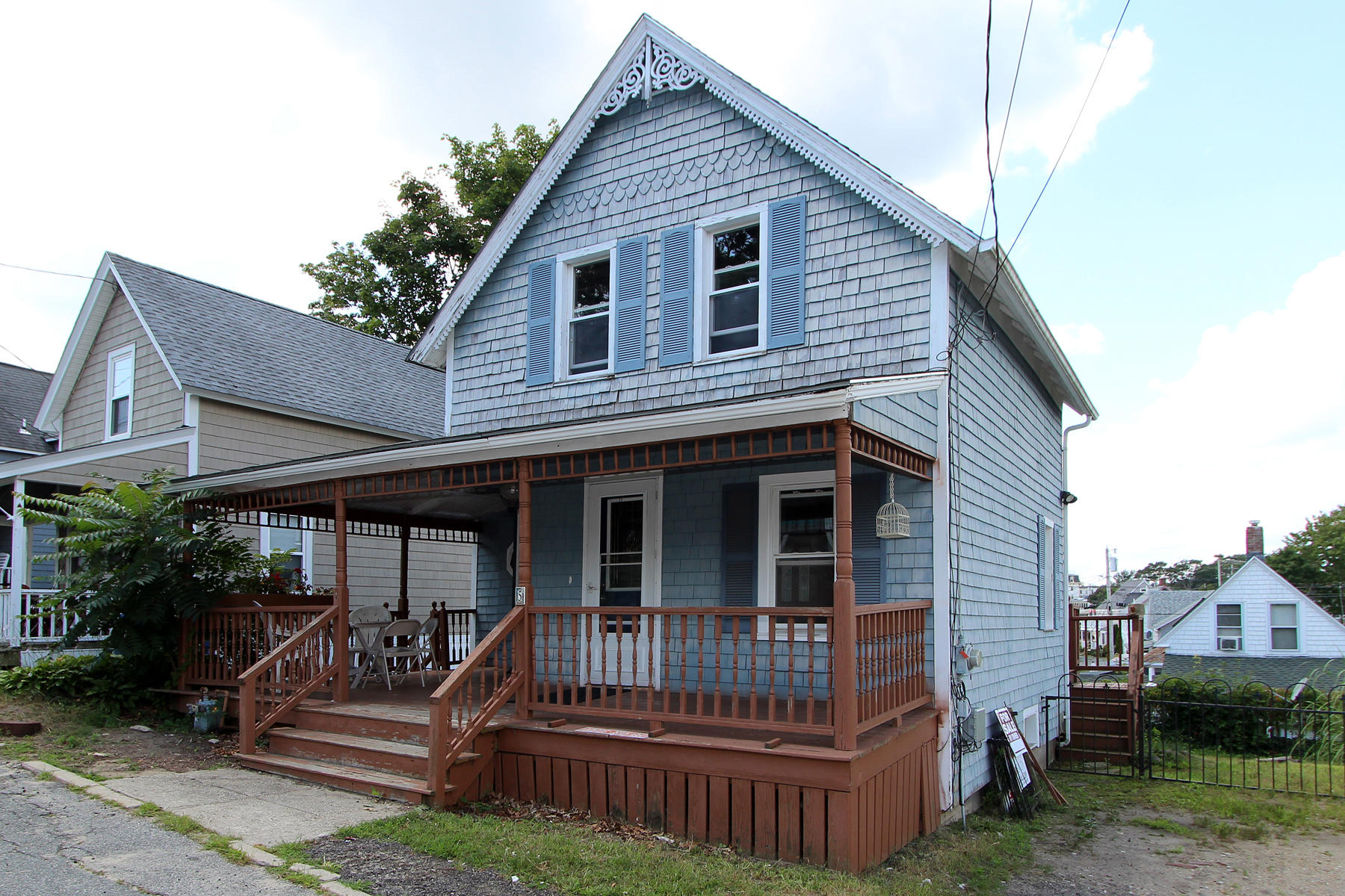 5 Admirals Way Buzzards Bay, MA 02532 - Photo 23 of 28 a view of a house with a small yard and wooden fence