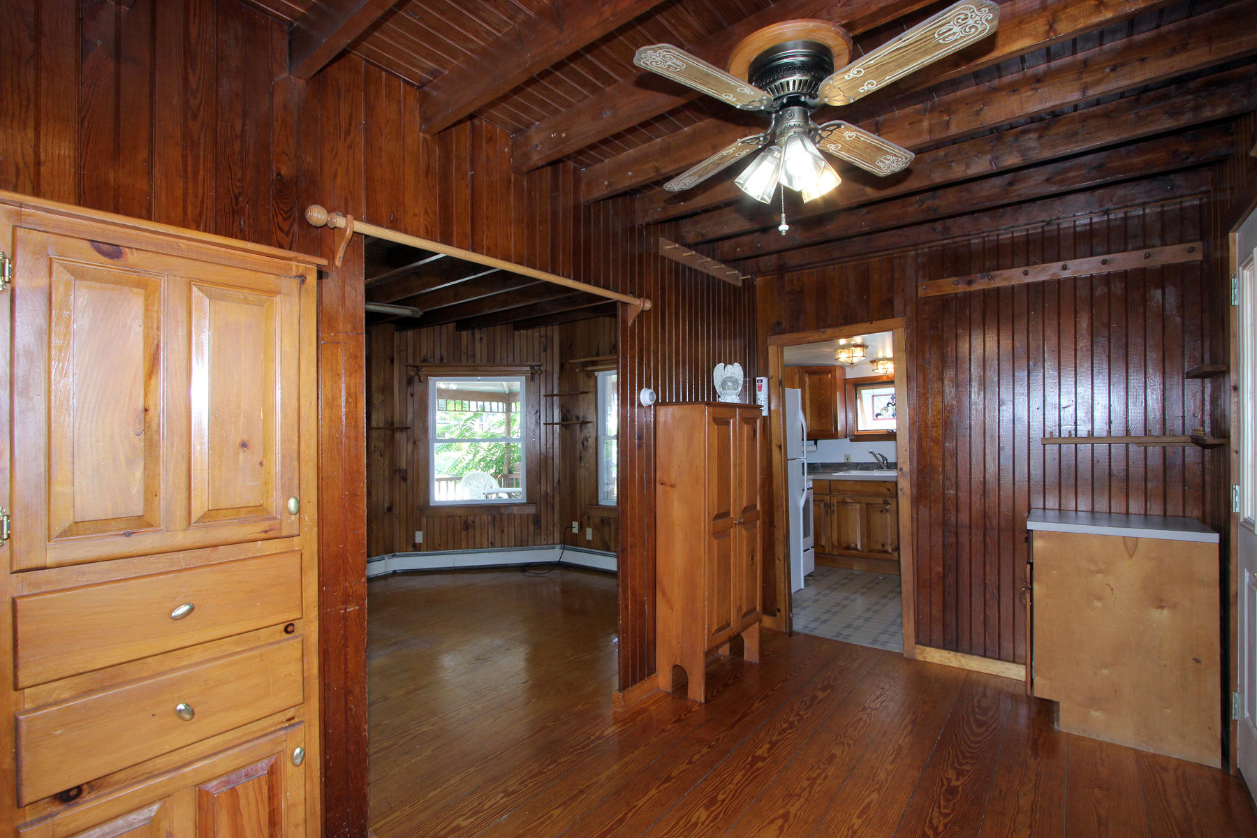 5 Admirals Way Buzzards Bay, MA 02532 - Photo 8 of 28 a view of empty room with wooden floor and fan