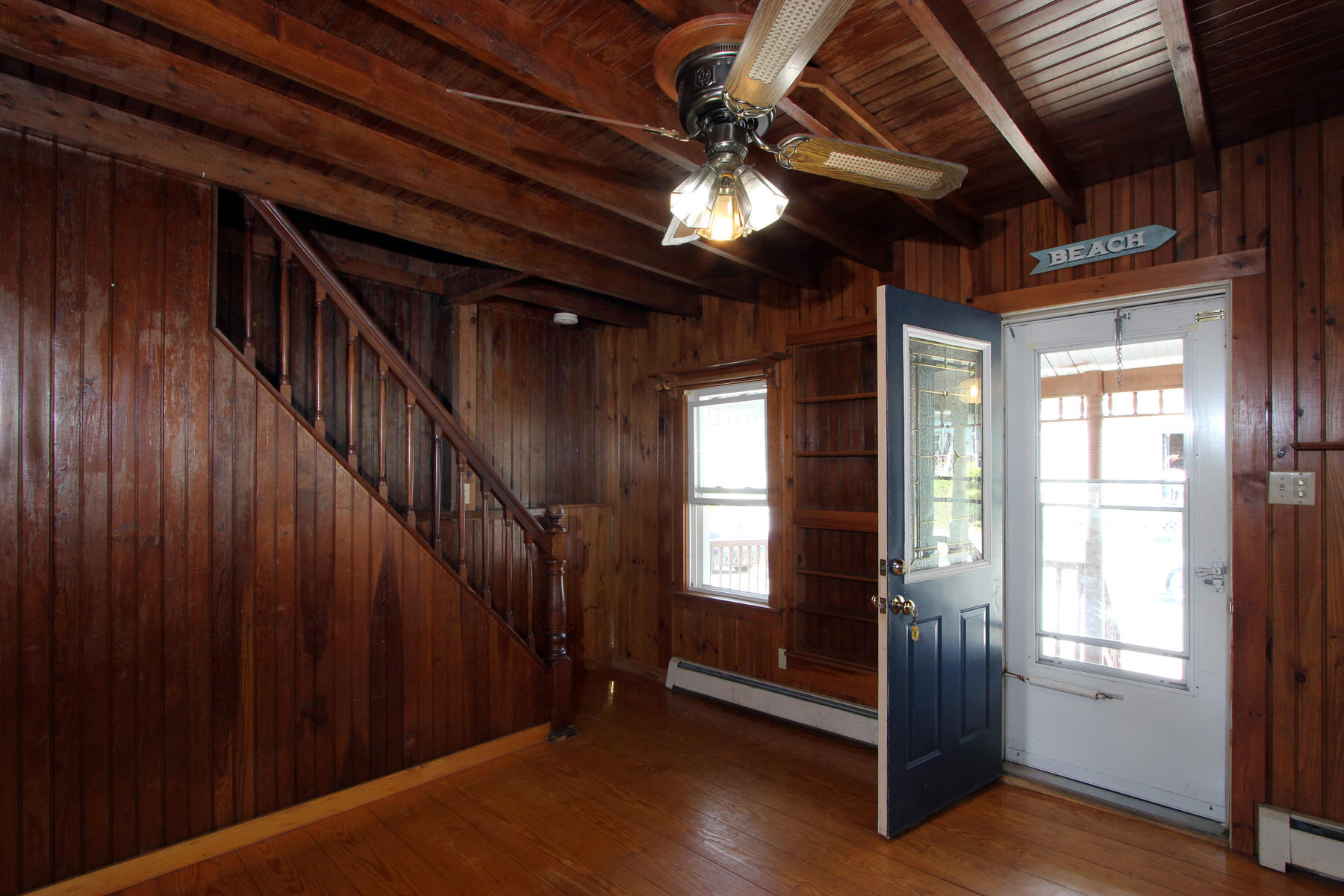 5 Admirals Way Buzzards Bay, MA 02532 - Photo 9 of 28 a view of an empty room with wooden floor and stairs