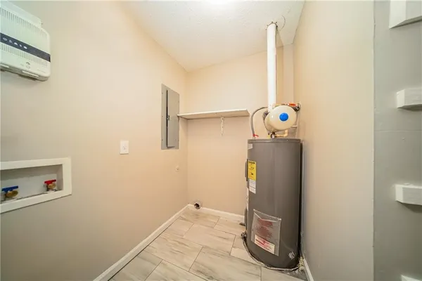 a view of storage and utility room with washer and dryer