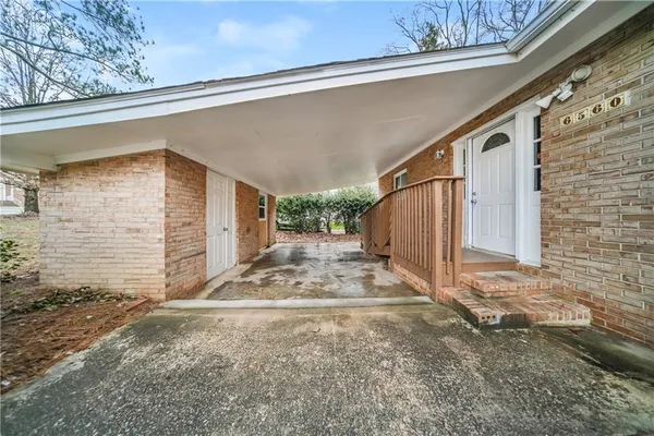 a view of backyard path and garage