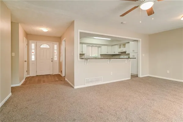 a view of a kitchen with a sink and cabinets