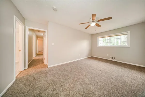 a view of an empty room with a window
