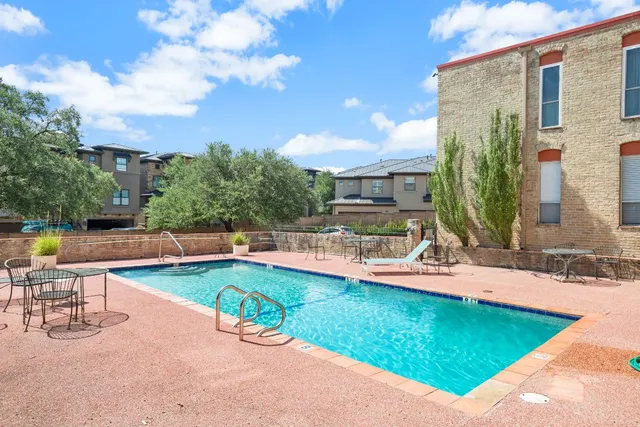 swimming pool view with a outdoor seating space