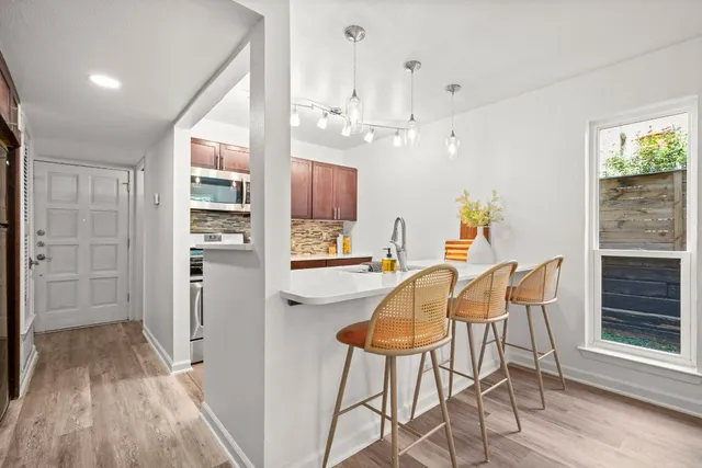 a view of a kitchen and dining room