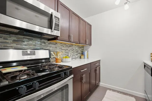 a kitchen with a stove and a microwave