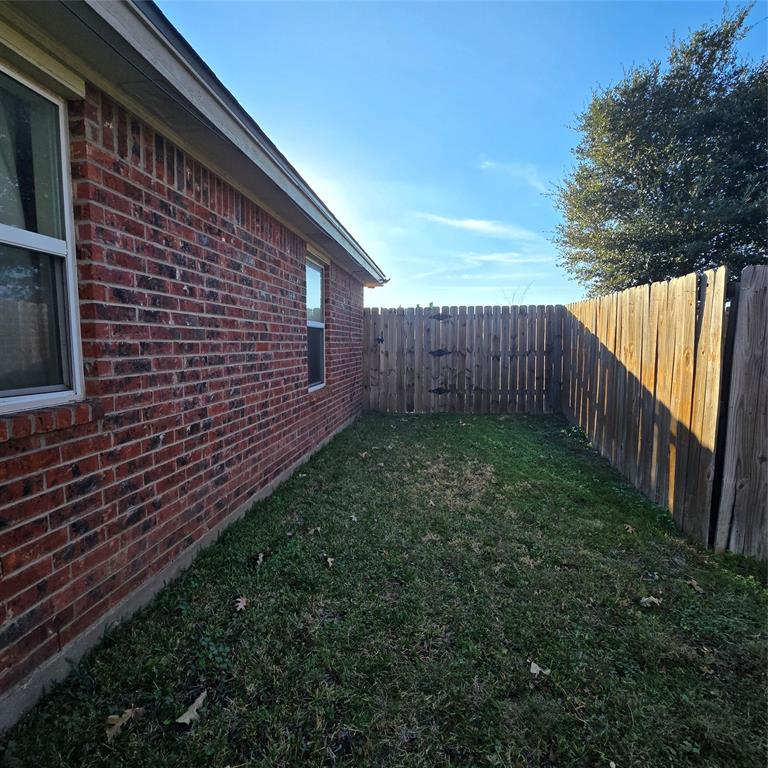 212 Druse Lane Jarrell, TX 76537 - Photo 11 of 38 a view of a backyard with wooden fence