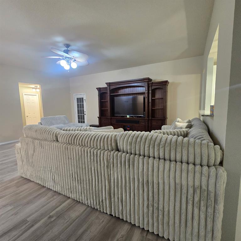212 Druse Lane Jarrell, TX 76537 - Photo 16 of 38 a living room with furniture and a flat screen tv