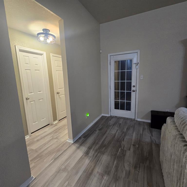 212 Druse Lane Jarrell, TX 76537 - Photo 18 of 38 wooden floor in an empty room with a window