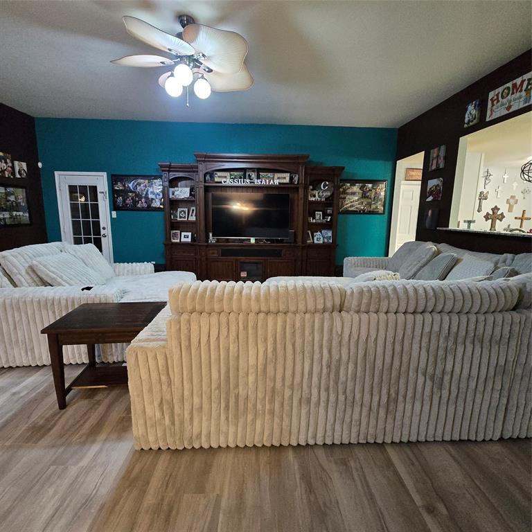 212 Druse Lane Jarrell, TX 76537 - Photo 2 of 24 a living room with furniture and a flat screen tv