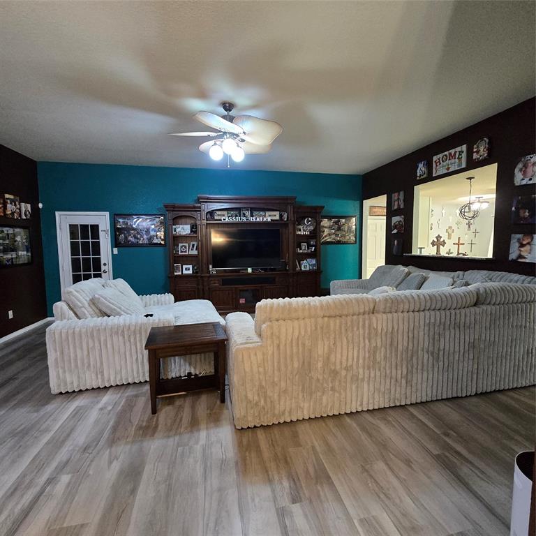 212 Druse Lane Jarrell, TX 76537 - Photo 3 of 24 a living room with furniture and a flat screen tv
