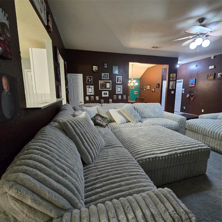 212 Druse Lane Jarrell, TX 76537 - Photo 5 of 24 a large bedroom with a bed a mirror and window