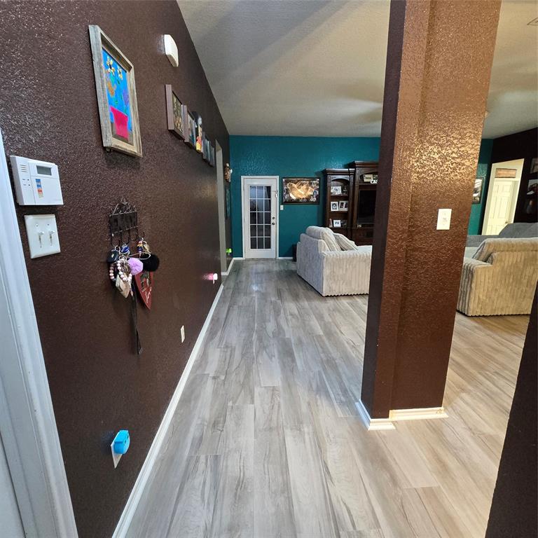 212 Druse Lane Jarrell, TX 76537 - Photo 6 of 24 a view of living room with furniture and wooden floor
