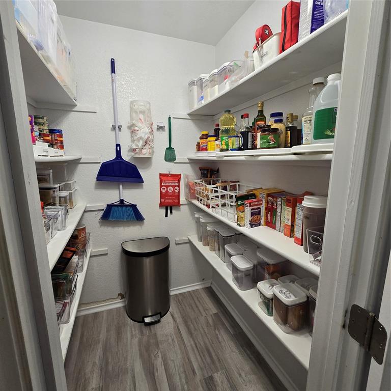 212 Druse Lane Jarrell, TX 76537 - Photo 9 of 38 a room with stainless steel appliances and wooden floor