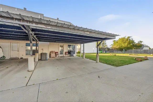 a bedroom with a bed and a flat tv screen
