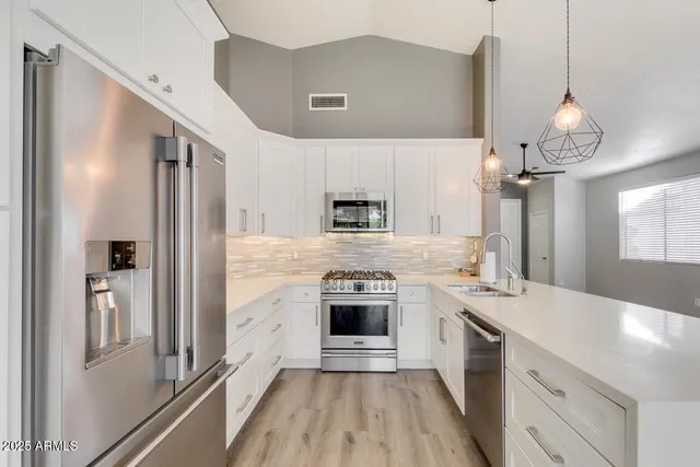 a kitchen with a stove oven and sink